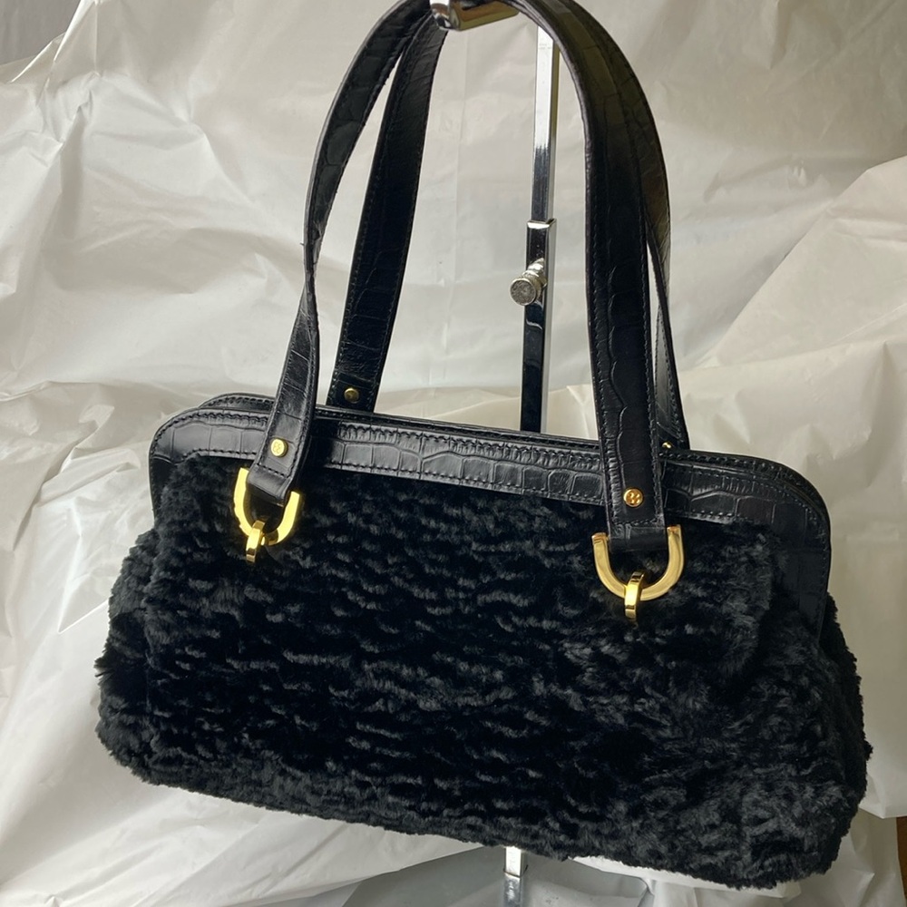 Kate Spade handbag and black shearling material.